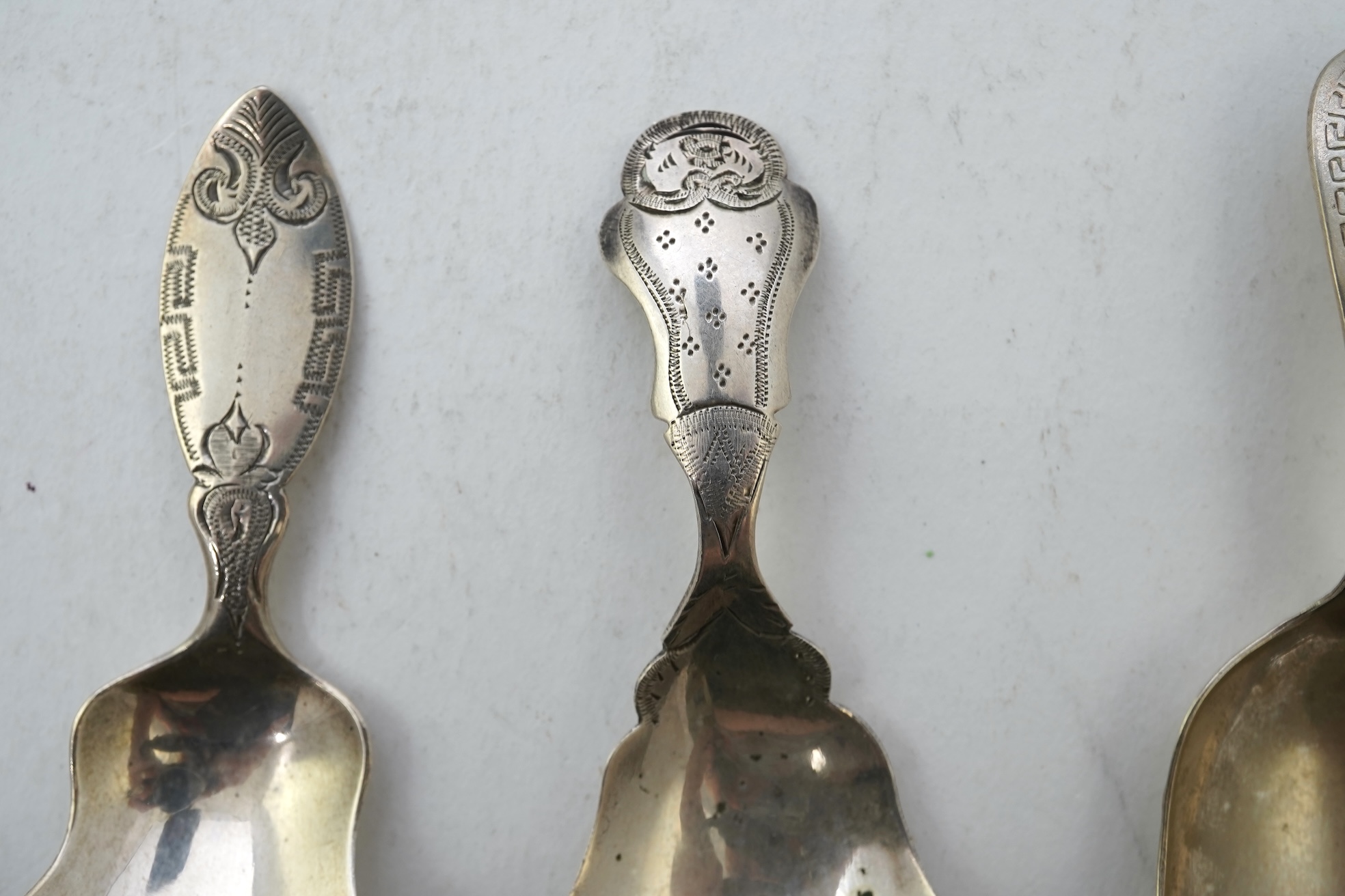 A collection of seventeen mainly 19th century Dutch white metal caddy spoons